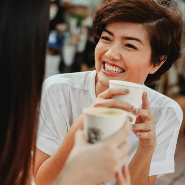 happy ladies sharing coffee